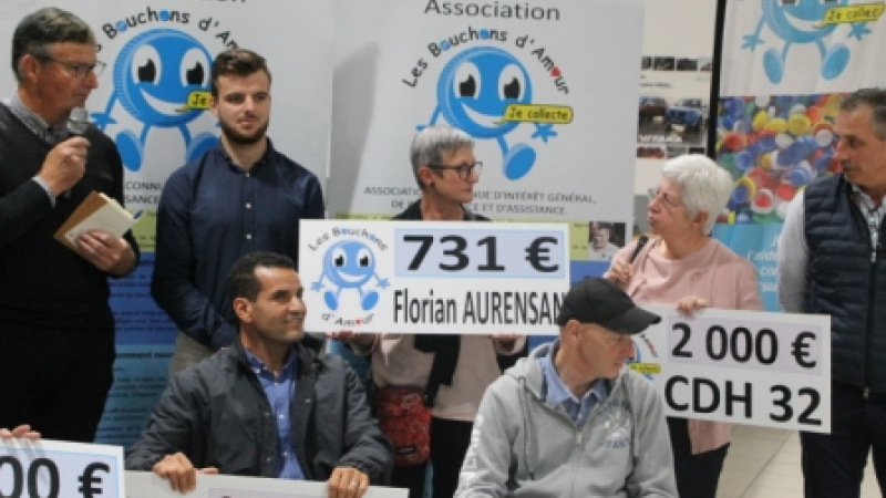 Remise des chèques Bouchons d'Amour au Grand Garage Auscitain 