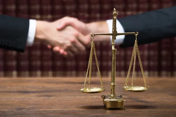 depositphotos_97931694-stock-photo-justice-scale-on-table-with.jpg